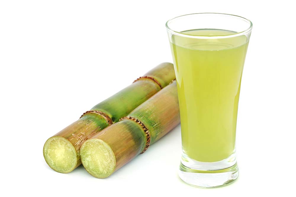 Drinking Sugarcane Juice